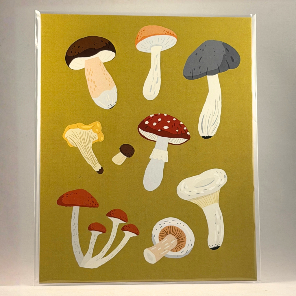 A 8x10 art print featuring a collection of illustrated wild mushrooms in various colors on a yellow-green background, enclosed in a clear protective sleeve.