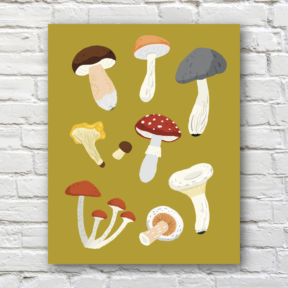 A vertical art print featuring a collection of illustrated wild mushrooms on a yellow-green background, displayed against a white brick wall.